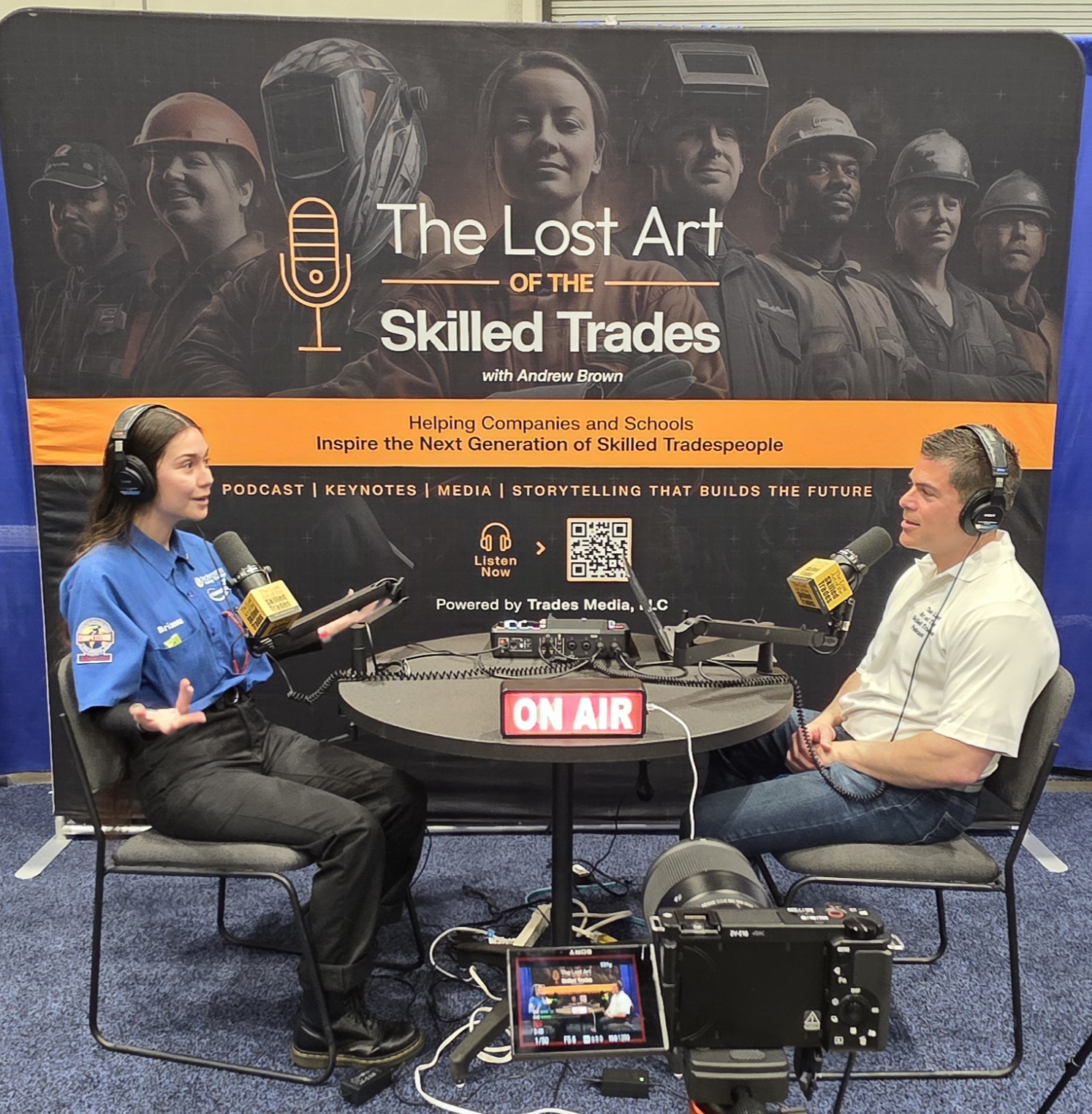 Andrew Brown interviewing a young apprentice technician on the podcast set