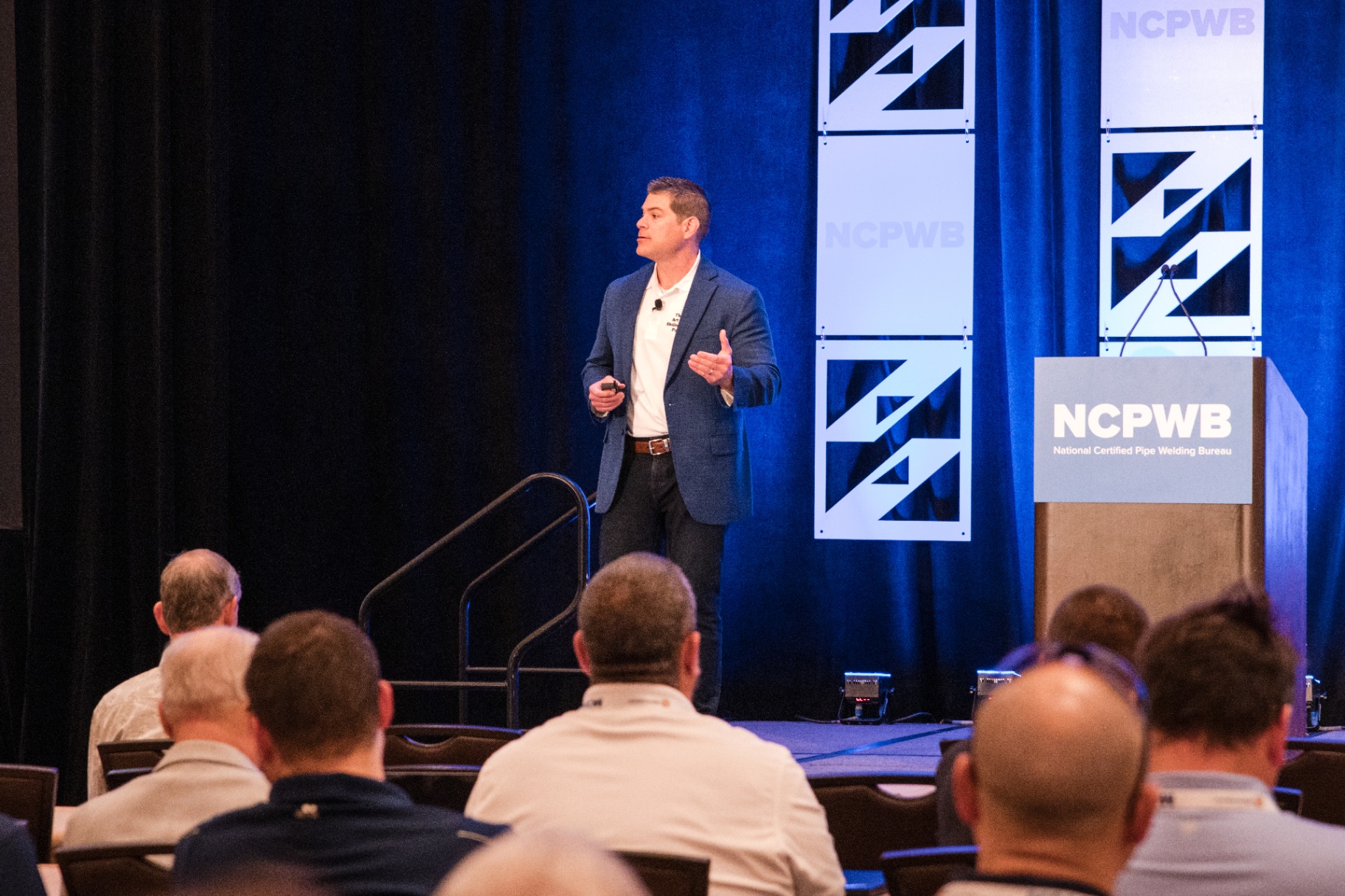 Andrew Brown engaging the audience on stage at NCPWB