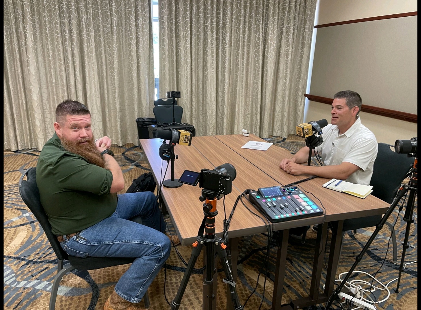 Andrew Brown recording a podcast interview at the AWS Weld Summit with a full mobile studio setup